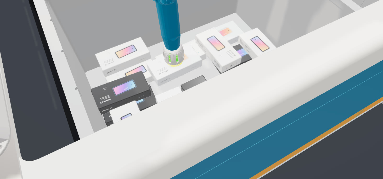 A robot suction gripper above a tote of boxed phones, seen from the picking camera.